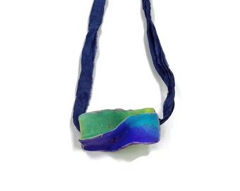 Handmade Polymer Clay Pendant with Dual Personality and Blue Marine Elegance