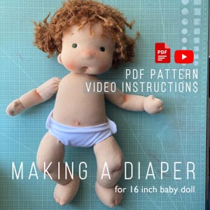May include: A handmade doll with red curly hair, freckles, and a white diaper. The doll is designed to be 16 inches tall. Text on the image reads "PDF Pattern Video Instructions" and "Making a Diaper".
