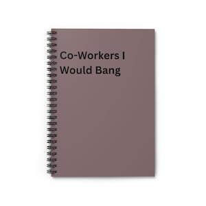 May include: A spiral-bound notebook with a mauve cover. The notebook features the text "Co-Workers I Would Bang" in black, centered on the cover. The spiral binding is black.