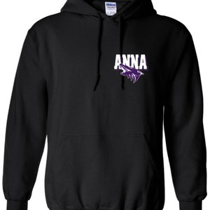 May include: Black hooded sweatshirt with a purple wolf graphic and the word "ANNA" in white letters.