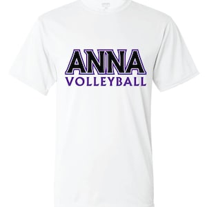 K&ouml;nnte beinhalten: Wei&szlig;es T-Shirt mit einer schwarzen und lila Grafik, auf der "ANNA VOLLEYBALL" steht.