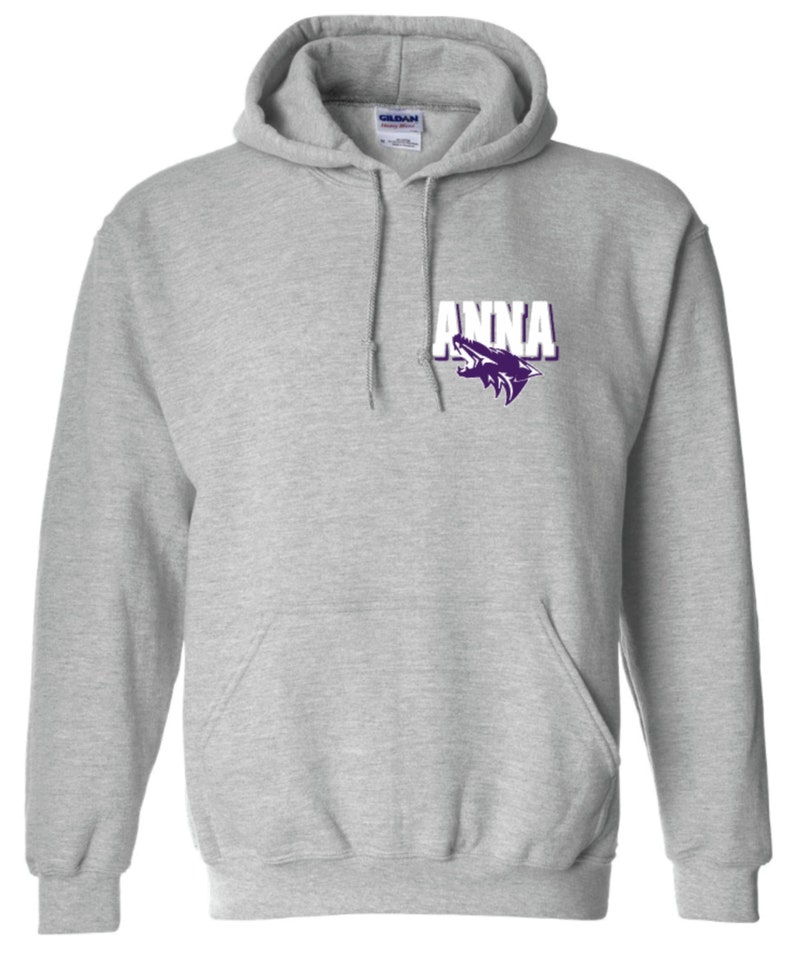 May include: A grey hooded sweatshirt with a white pocket on the front. The pocket has a purple wolf logo and the word "ANNA" in white letters.