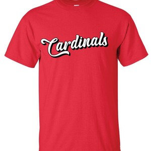 May include: Red t-shirt with the word "Cardinals" in white script.