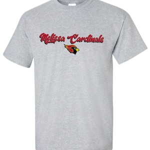 May include: A gray t-shirt with the text "Melissa Cardinals" in red and black lettering. A red cardinal mascot is below the text.