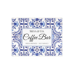 May include: A white sign with blue and white patterned tiles. The sign says "Silva & Co. Coffee Bar" and "Fresh Brewed - Self Service".