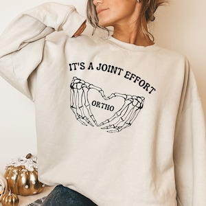 Its a joint effort ortho sweatshirt, funny ortho shirt, gift for Orthopedic, oversized skeleton hand top, Rheumatologists sweater