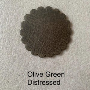 Olive green leather rosette.