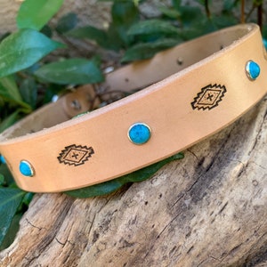 Natural color leather dog collar with diamond shapes and turquoise stones.
