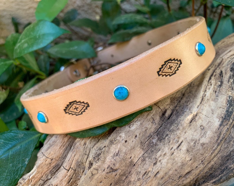 Natural color leather dog collar with diamond shapes and turquoise stones.