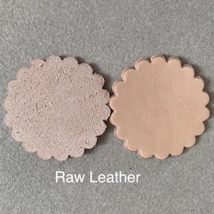 Natural color leather rosette.