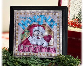 Puede incluir: Un diseño de punto de cruz enmarcado con un Papá Noel de dibujos animados con el texto "Home for Christmas".