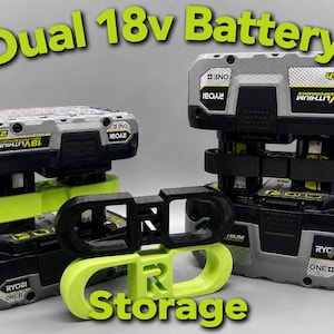May include: Two Ryobi 18V lithium battery packs stacked vertically, held together by a lime green plastic connector. A black plastic connector sits in front, with a lime green connector below it. Text reads Dual 18v Battery Storage.