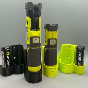 May include: A collection of Ryobi brand power tool accessories, including a flashlight and battery holders. The flashlights are yellow and black, with the Ryobi logo visible. The battery holders are black and neon green.