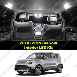 May include: A silver 2014-2019 Kia Soul with a red trim along the bottom. The car is facing the camera and is on a white background. The text "2014-2019 Kia Soul Interior LED Kit" is displayed above the car.