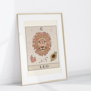 May include: A printable zodiac sign poster featuring a line drawing of a lion's head with a pink and orange color scheme. The poster also includes a constellation, a crystal, a sunflower, and the text "LEO" and the astrological symbol for Leo.