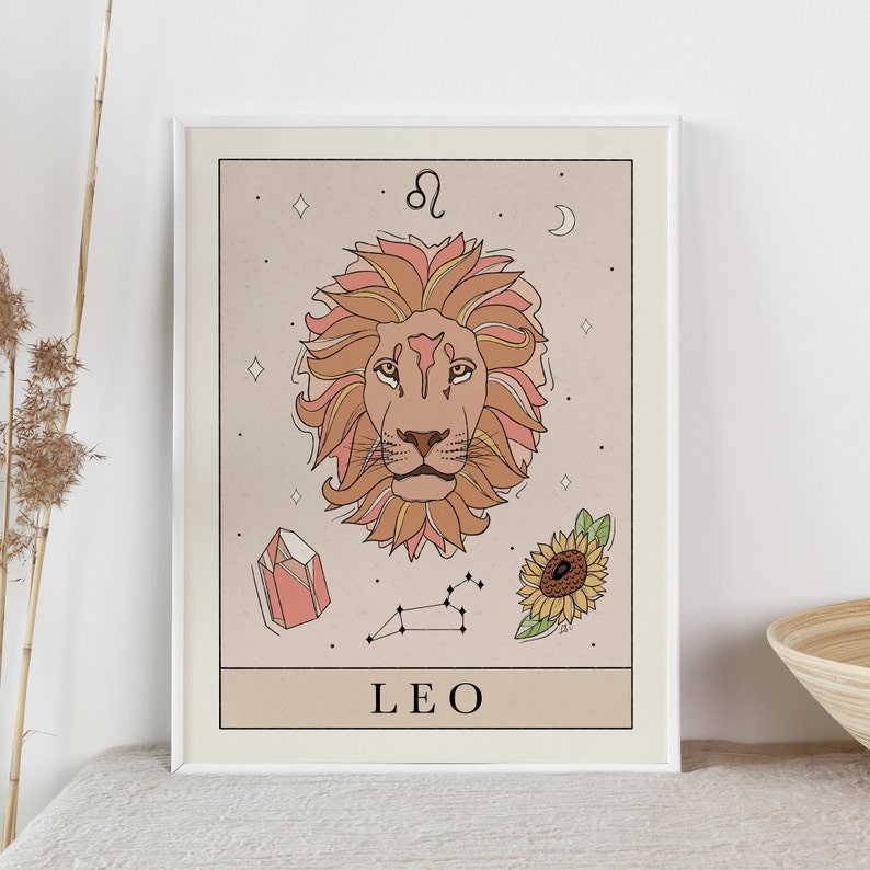 May include: A beige and peach colored illustration of the Leo zodiac sign. The illustration features a lion's head with a sunflower, a crystal, and a constellation in the background. The text "LEO" is written below the lion's head.