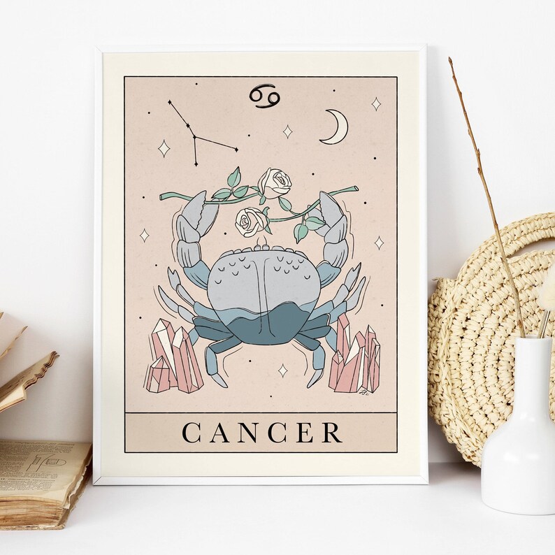 May include: A pastel pink and blue illustration of the Cancer zodiac sign. The illustration features a crab with a rose stem and white roses, pink crystals, and the constellation Cancer. The text "CANCER" is written below the crab.