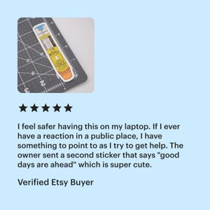 A five star review from a verified Etsy buyer of the epi-pen "I'm probably allergic" sticker that says "I feel safer having this on my laptop. If I ever have a reaction in a public place, I have something to point to as I try to get help. The owner sent a second sticker that says 'good days are ahead' which is super cute"

The thumbnail shows a sticker of a yellow EpiPen with an orange cap that says “I’m Probably Allergic”. The sticker is on a cutting mat and is 4 inches tall and 1 inch wide.