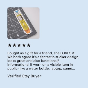 A five star review from a verified Etsy buyer of the epi-pen "I'm probably allergic" sticker that says "bought as a gift for a friend, she LOVES it. We both agree it's a fantastic sticker design, looks great and also functional/informational if worn on a visible item in public (like a water bottle, laptop, cane/...)

The thumbnail shows a sticker of a yellow EpiPen with an orange cap that says “I’m Probably Allergic”. The sticker is on a cutting mat and is 4 inches tall and 1 inch wide.