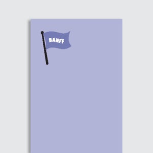 May include: A light purple rectangular background featuring a small, dark purple flag on a black pole. The flag displays the white text BANFF in a bold, sans-serif font. The design is positioned in the upper left corner of the field.