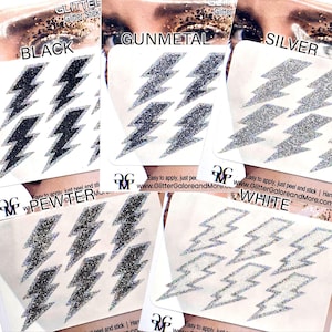 May include: Six sheets of self-adhesive glitter lightning bolt stickers in black, gunmetal, silver, and white. Each sheet has four lightning bolts. The sheets are labelled with the colour of the glitter. The text "Easy to apply, just peel and stick | www.GlitterGaloreandMore.com" is on each sheet.