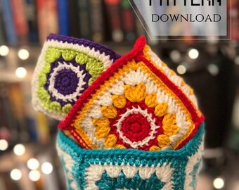 May include: A crochet pattern download for a colorful crocheted bowl. The bowl is made of squares in shades of green, yellow, red, white, and blue.