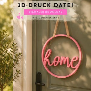 May include: A pink circular home sign hanging on a green door. The word "home" is written in cursive script within the circle. The sign is suspended by tan straps. Text at the top reads "3D-DRUCK DATEI" and "DIGITALER DOWNLOAD".