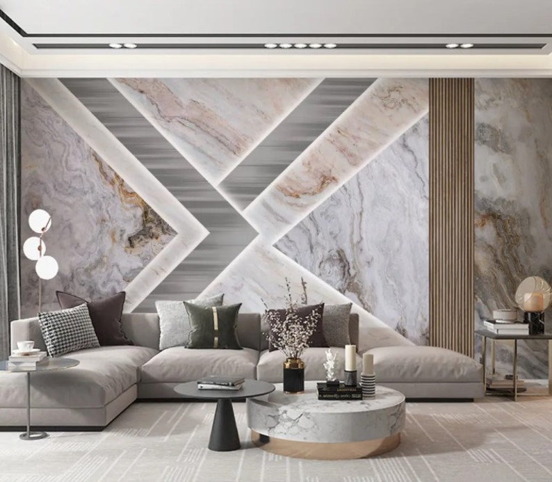Puede incluir: Un sal&oacute;n moderno con un sof&aacute; seccional, una mesa de caf&eacute; y una pared decorativa con un patr&oacute;n geom&eacute;trico de m&aacute;rmol blanco y gris. La pared presenta un fondo gris claro con un patr&oacute;n de m&aacute;rmol blanco y gris.