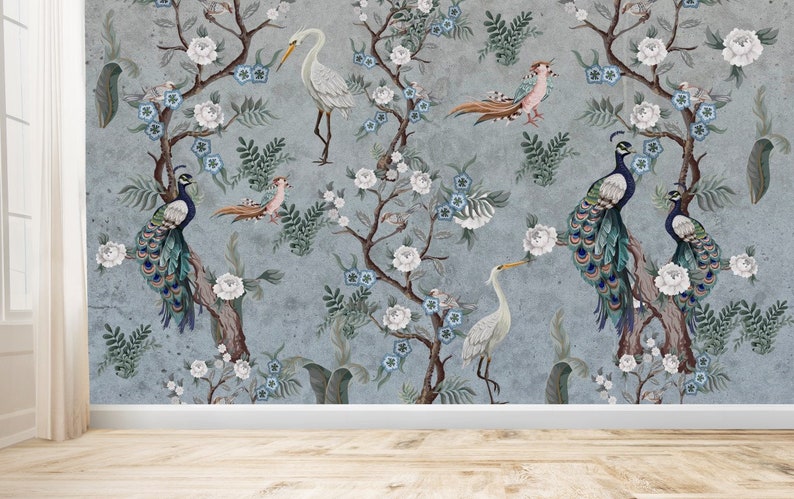 May include: A blue and gray wallpaper with a floral pattern featuring white flowers, blue flowers, and green leaves. Peacocks and white birds are perched on the branches of the trees.