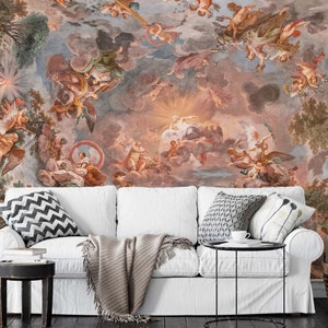 May include: A white couch with a throw blanket and pillows in front of a mural depicting a colorful, ornate ceiling with angels and cherubs.