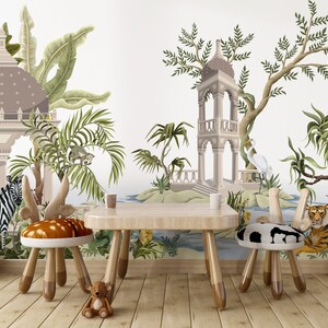 May include: A children's playroom with a jungle-themed mural featuring a white zebra, a tiger, a toucan, and a white bird. The room has a wooden table and two wooden chairs with animal-themed cushions.