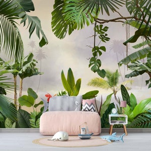 May include: A pink upholstered bed with a tropical jungle mural wallpaper featuring lush green palm trees and leaves. The bed has a white and gray patterned pillow and a pink and gray patterned pillow. A small wooden side table with a lamp and a clock sits next to the bed.