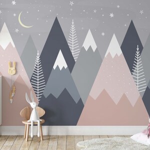 May include: A nursery wall mural featuring a pink and blue mountain range with white snow peaks and white trees. The mural is decorated with white stars and a crescent moon. The text "Sweet Baby Love" is on a sign in the foreground.