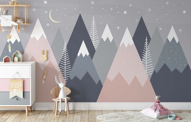 May include: A nursery wall mural featuring a pink and blue mountain range with white snow peaks and white trees. The mural is decorated with white stars and a crescent moon. The text "Sweet Baby Love" is on a sign in the foreground.