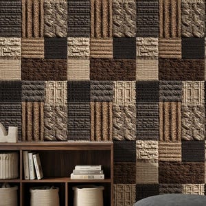 May include: A textured wall covering with a patchwork design. The squares feature various woven patterns in shades of brown, beige, and black. A wooden shelf with books and woven baskets is in the foreground.