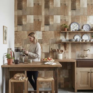 May include: A set of three ceramic mugs with a speckled, matte finish. The mugs are in shades of cream, light gray, and dark gray. Each mug has a simple, minimalist design, perfect for coffee or tea.