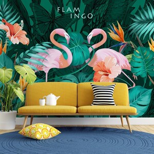 May include: A yellow couch with a striped pillow sits in front of a tropical mural featuring pink flamingos, green leaves, and orange flowers. The mural has the text "FLAMINGO" at the top.