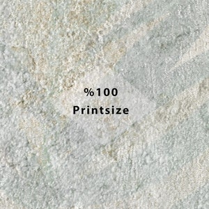 Puede incluir: Primer plano de una superficie texturizada de color gris claro con el texto "% 100 Printsize" en negro.