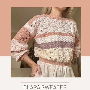 May include: A crochet sweater pattern called "Clara Sweater" designed by Laramiloops. The pattern features a striped design in shades of pink, cream, and purple.