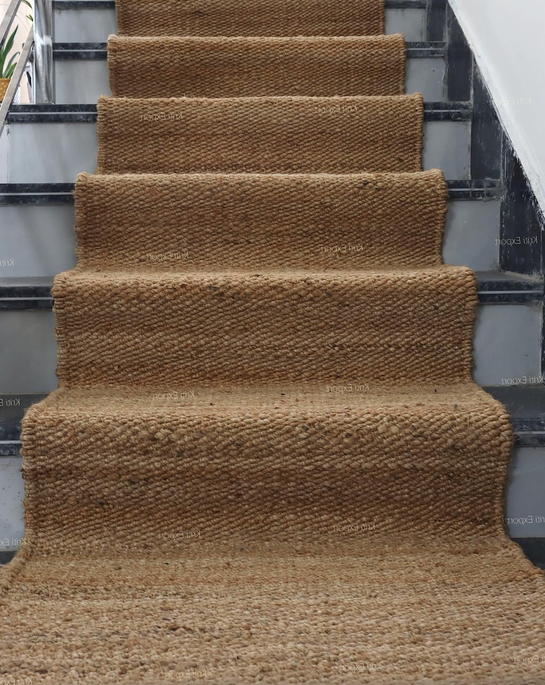 Handmade natural jute stair runner rug made from durable hemp and jute fibers, perfect for custom stairways and hallways. This eco-friendly, rustic runner features a minimalist woven texture ideal for farmhouse, boho, or modern decor. Perfect as a custom-size rug or stair carpet, it brings warmth, sustainability, and a natural touch to any interior space. Designed for high-traffic areas and handcrafted with care.