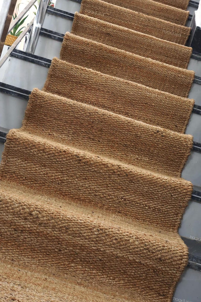 Handmade natural jute stair runner rug made from durable hemp and jute fibers, perfect for custom stairways and hallways. This eco-friendly, rustic runner features a minimalist woven texture ideal for farmhouse, boho, or modern decor. Perfect as a custom-size rug or stair carpet, it brings warmth, sustainability, and a natural touch to any interior space. Designed for high-traffic areas and handcrafted with care.