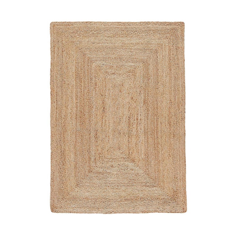 May include: A natural fiber rug with a woven design. The rug has a rectangular shape and a light brown color.