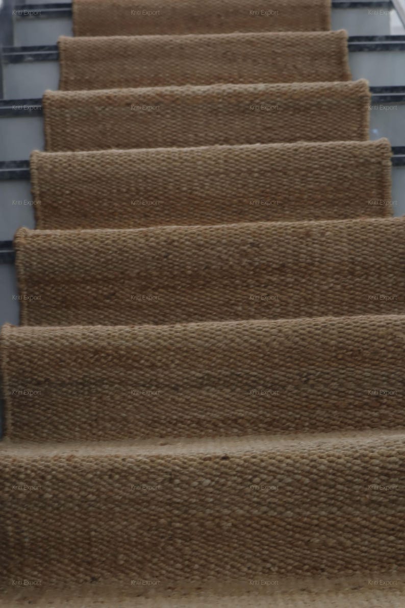 Handmade natural jute stair runner rug made from durable hemp and jute fibers, perfect for custom stairways and hallways. This eco-friendly, rustic runner features a minimalist woven texture ideal for farmhouse, boho, or modern decor. Perfect as a custom-size rug or stair carpet, it brings warmth, sustainability, and a natural touch to any interior space. Designed for high-traffic areas and handcrafted with care.