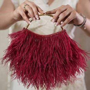 Cartera de mano de plumas hecha a mano de diseñador