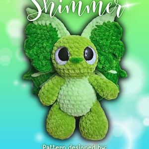 May include: A crocheted green creature with large, glittery eyes and textured wings. The word "Shimmer" is written in cursive at the top. The text "Pattern designed by: @rainbow.stripe.crafts" is at the bottom.