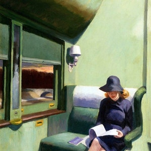 May include: A woman wearing a black hat and a dark blue dress sits on a green train seat and reads a book. The train car is painted green and has a window with a view of a sunset.