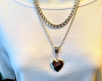 PN CL 10 1   Collana con cuore annodato e diamanti bianchi   Marco Gerbella