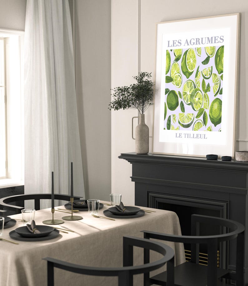 May include: A framed print with a white background and a green citrus fruit pattern. The text "LES AGRUMES" and "LE TILLEUL" is printed in gray at the top and bottom of the print.