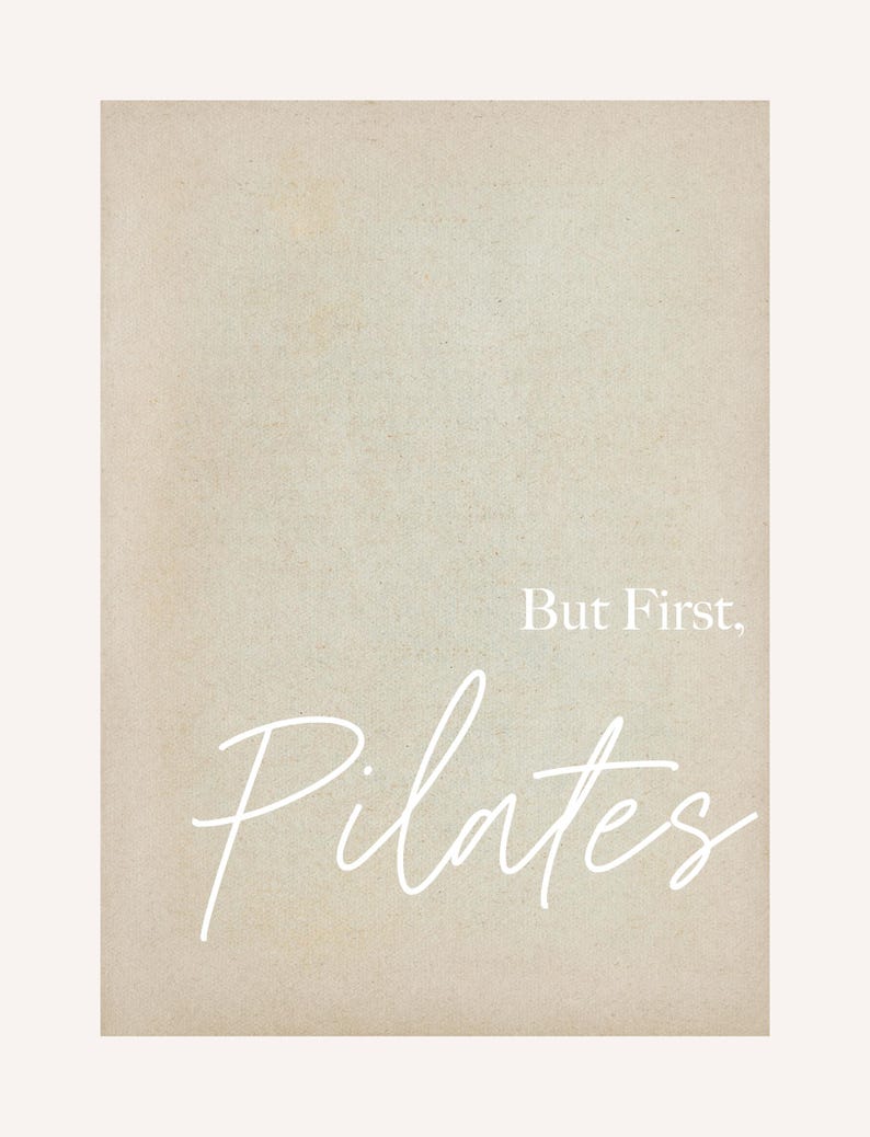 May include: A beige-toned print with the words "But First, Pilates" in white script. The background has a textured appearance, and the text is centered on the print.