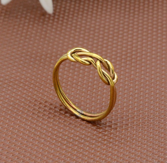 Anello con doppio nodo, anello con nodo d'amore, anello con doppio